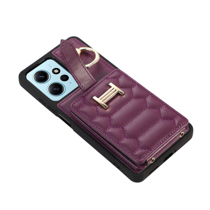 Dark purple quilted phone case with card holder flap and ring grip detail