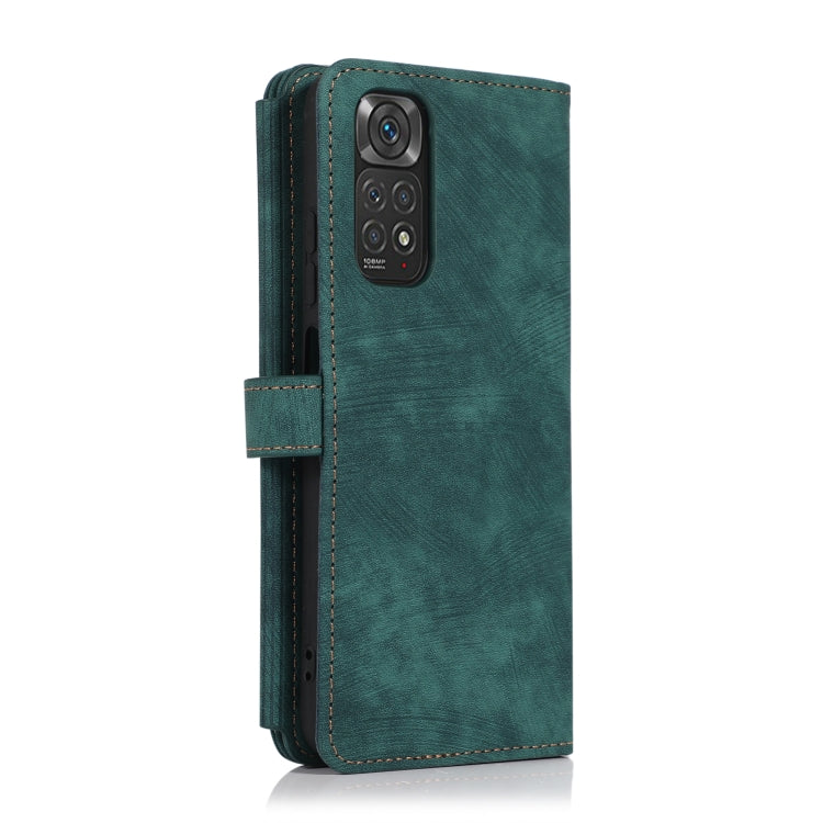 Green leather phone wallet case with vertical zipper and side flip strap, phone shown