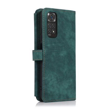 Green leather phone wallet case with vertical zipper and side flip strap, phone shown
