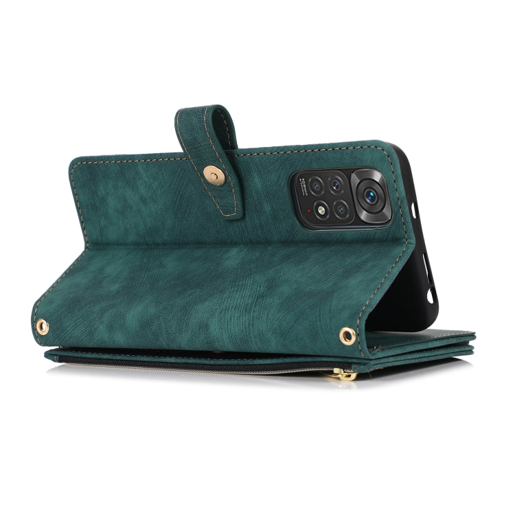 Green leather folio phone case with zipper and foldover strap, slim side view