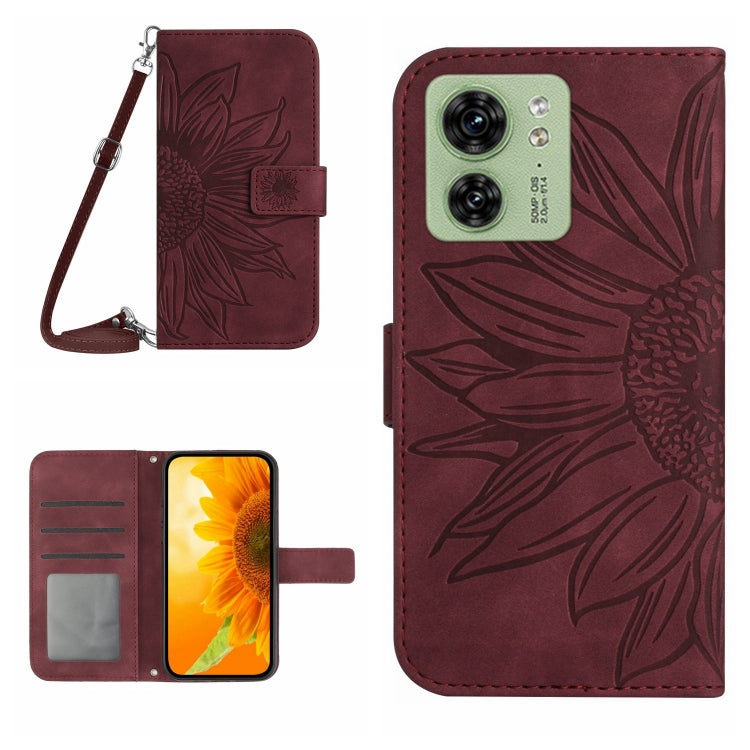 Wine red embossed flip leather phone case with lanyard, card slot, and front cover.