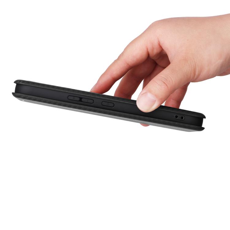 Black flip phone case edge view with hand holding the cover.