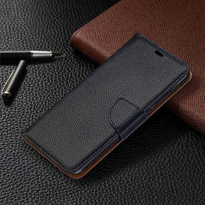 Textured leather flip phone case with card slot and stitched strap detail.