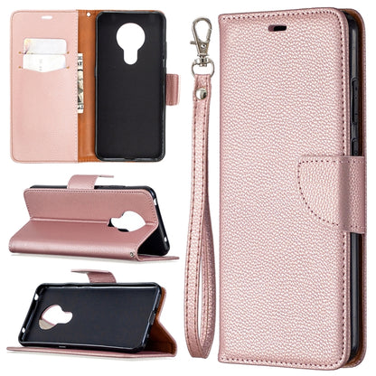 Rose pink textured leather flip phone case with card slots and wrist lanyard strap