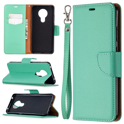 Mint green textured leather flip phone case with card slots and wrist lanyard strap
