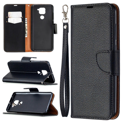 Black textured leather flip phone case with card slots and wrist lanyard strap