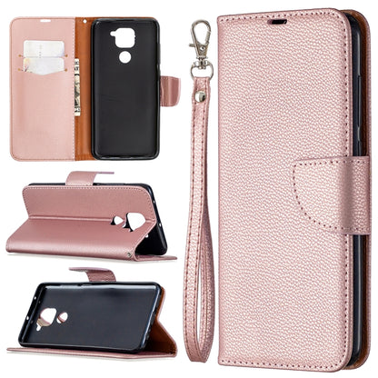 Light pink textured leather flip phone case with card slots and wrist lanyard strap