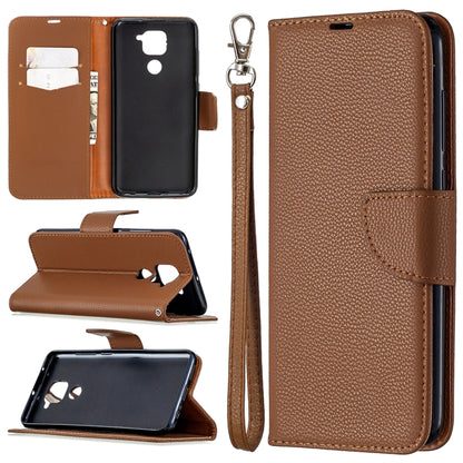 Brown textured leather flip phone case with card slots and wrist lanyard strap