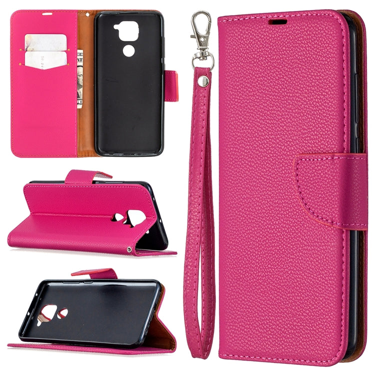 Pink leather phone case with card slots, stand, and wrist lanyard strap