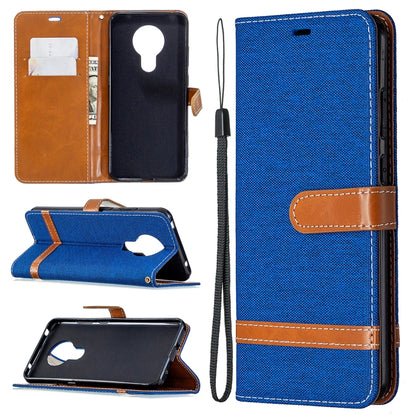 Blue denim flip phone wallet case with card slots, stand and lanyard strap