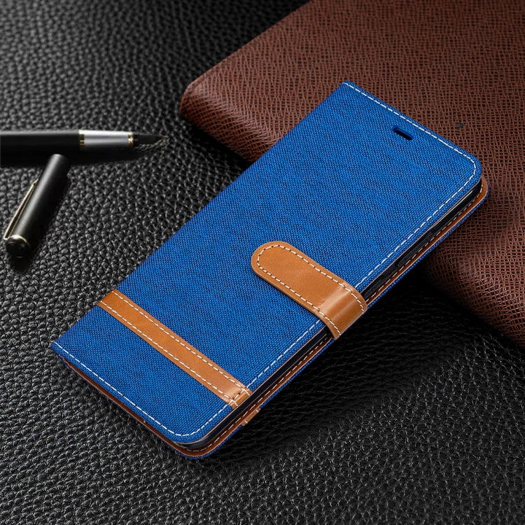 Blue denim flip wallet phone case with brown flap and card/ID storage