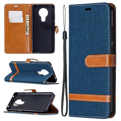 Blue denim flip phone wallet case with lanyard and card slots, open view