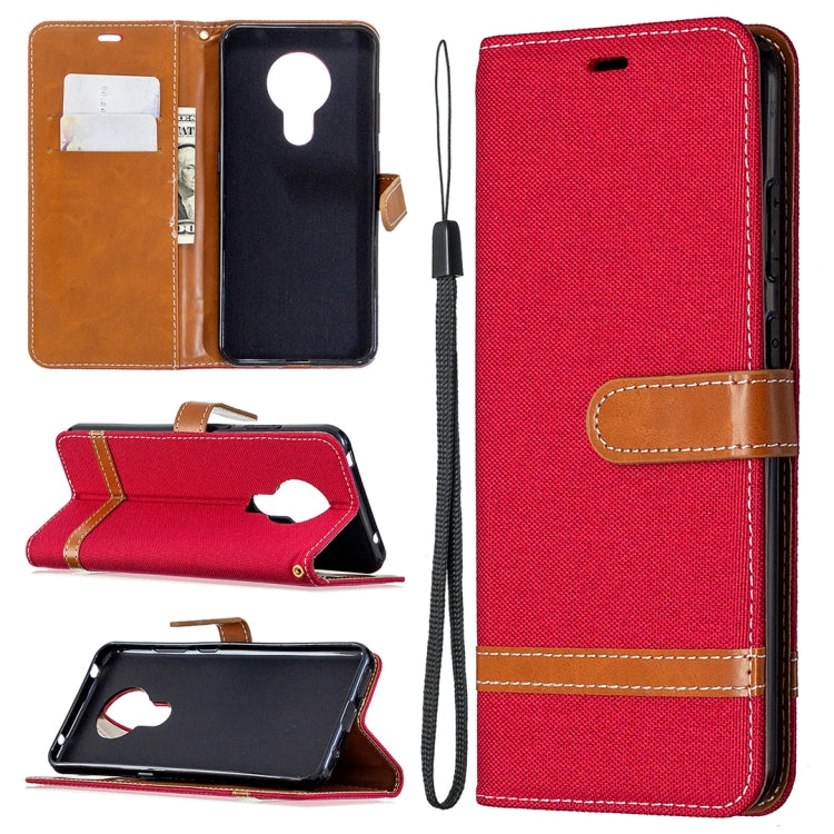 Red denim flip phone wallet case with card slots and lanyard strap
