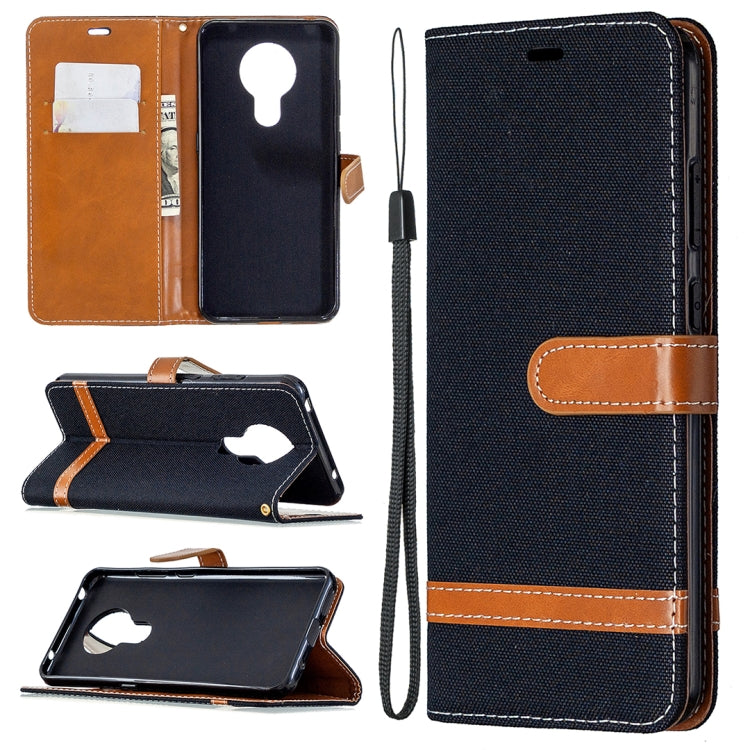 Denim-textured flip phone case with card slots and lanyard, dark navy blue with tan accents