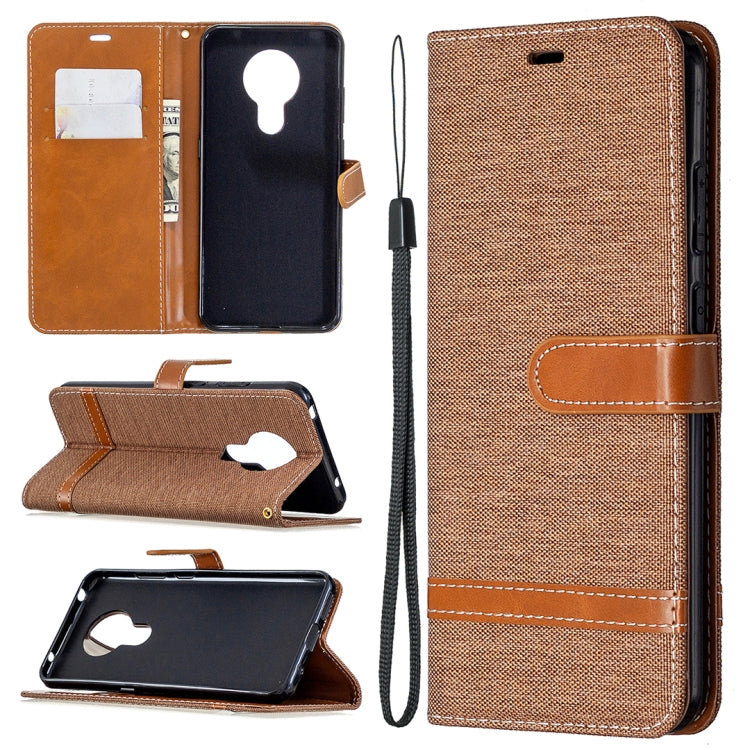 Denim-textured flip phone case with card slots and lanyard, brown with tan accents