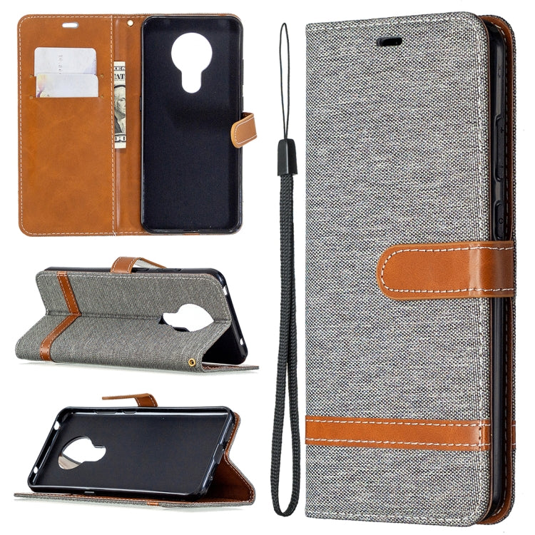 Denim-textured flip phone case with card slots and lanyard, heather gray with tan accents