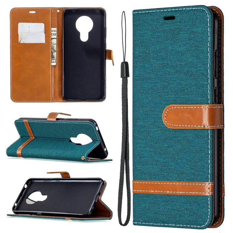 Denim-textured flip phone case with card slots and lanyard, teal green with tan accents