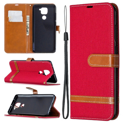 Denim-textured flip phone case with card slots and lanyard, red with tan accents