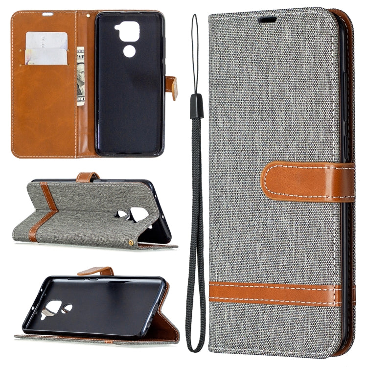 Denim-textured gray flip wallet phone case with card slots and lanyard strap, brown trim