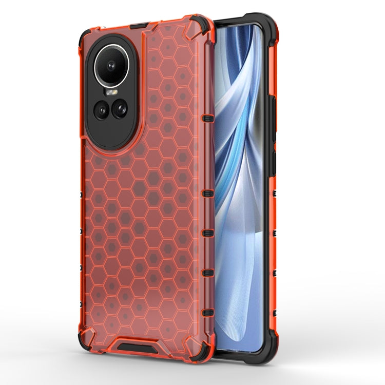 Honeycomb shockproof phone case in orange-red with black bumper, hex grip texture