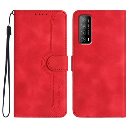 Red wallet-style leather phone case with heart-pattern cutout and wrist strap