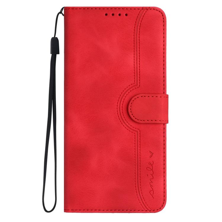 Red leather flip phone case with wrist strap and heart-shaped detail on front flap