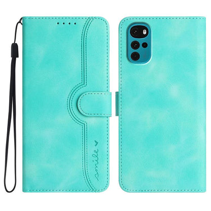 Light blue leather folio phone case with wrist strap and heart-shaped embossed panel