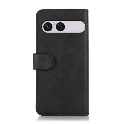 Black cow-texture leather phone case with folio flap and dual-camera cutout.