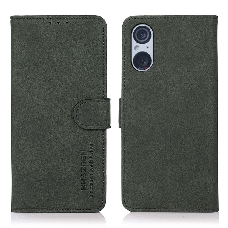 Green matte leather flip phone case with side strap and camera cutout
