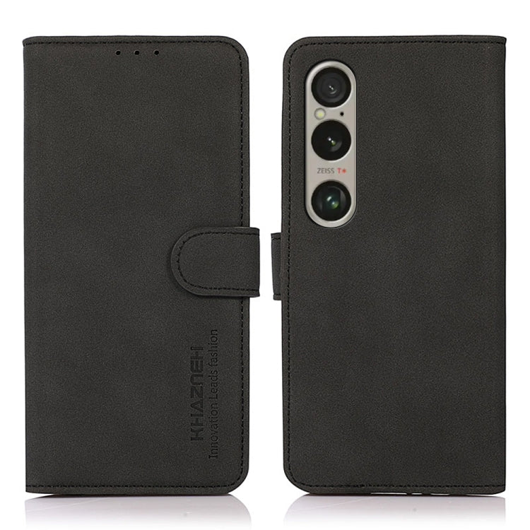 Black matte leather flip phone case with side strap and camera cutout
