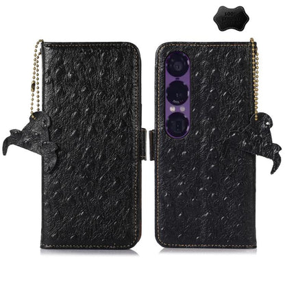 Black ostrich leather phone wallet case with animal charm and beaded side strap
