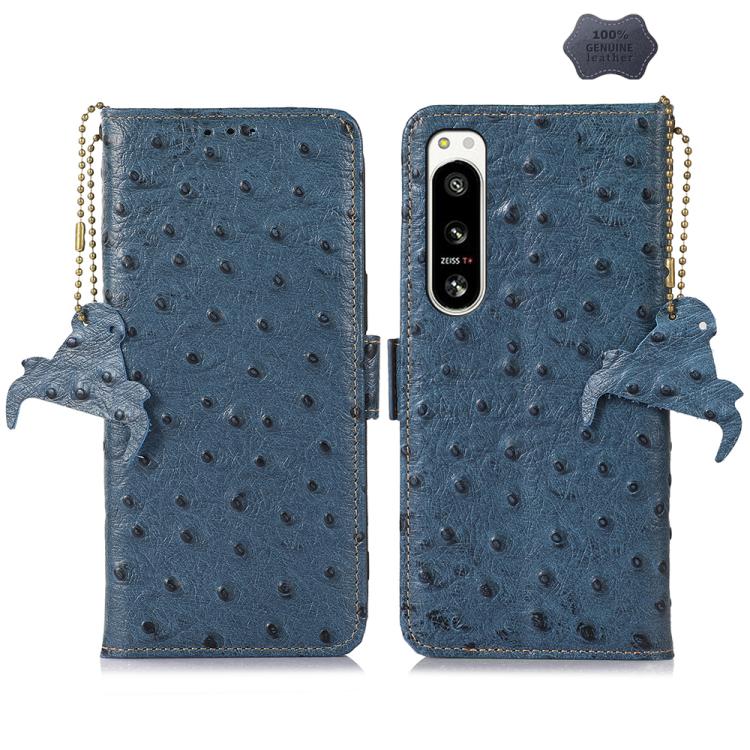 Blue ostrich leather phone wallet case with single camera cutout, animal charm and strap