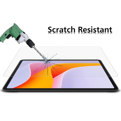 Tablet tempered glass screen protector film showing scratch-resistant surface test