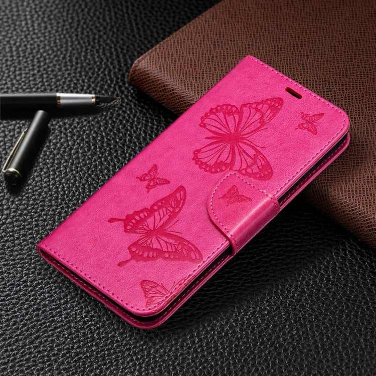 Hot pink leather phone wallet case with embossed butterfly pattern and card holder