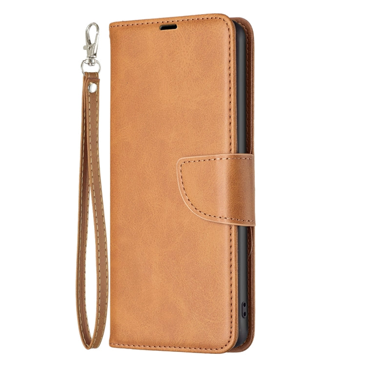 Tan flip leather phone case with wrist strap and side button cutouts