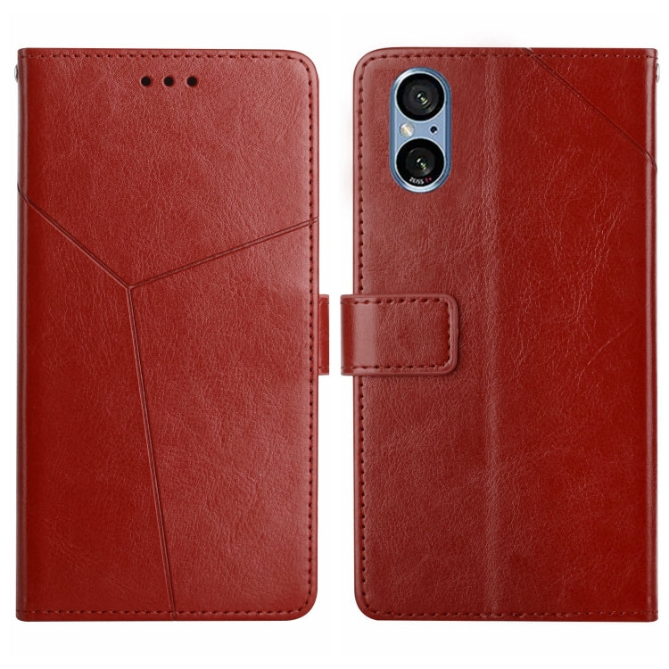 Brown Y-pattern flip leather phone case with card slot and camera cutout
