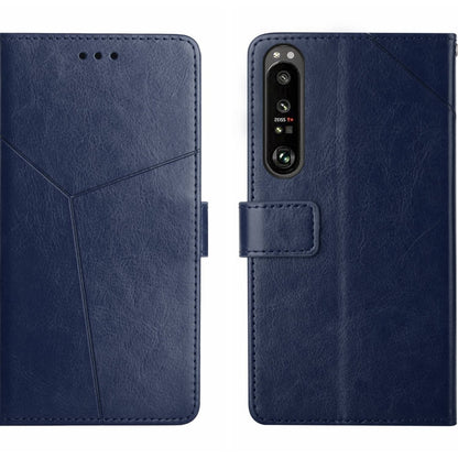 Y-pattern flip leather phone case in blue, with camera cutout and card holder