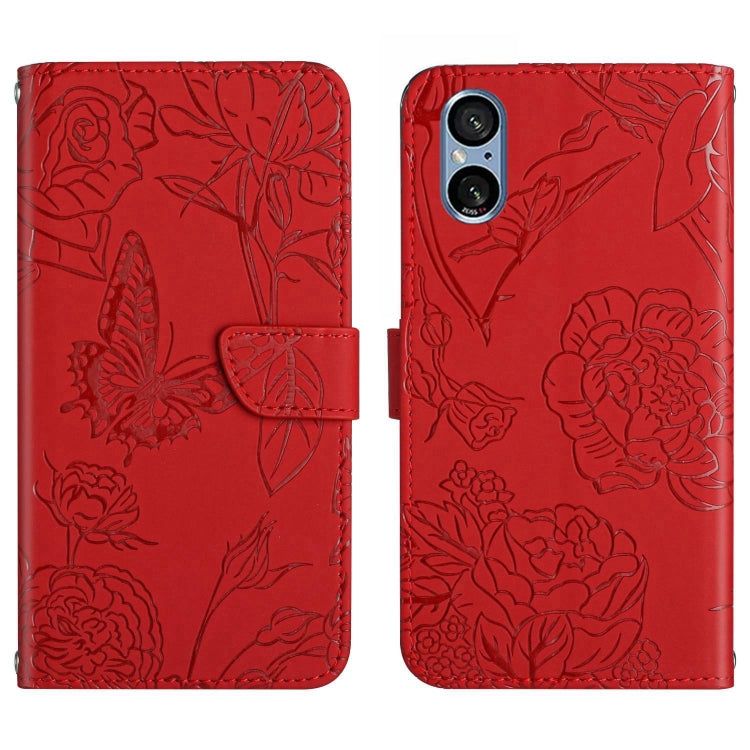 Red butterfly embossed flip leather phone case with folding flap and embossed flowers