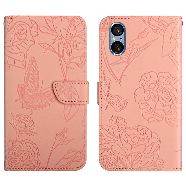 Blush pink butterfly embossed flip leather phone case with folding flap and floral pattern