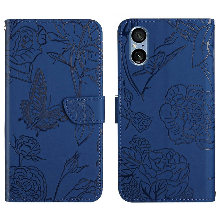 Blue butterfly embossed flip leather phone case with folding flap and embossed floral leaves