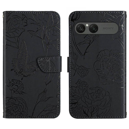 Black flip leather phone case with embossed butterfly-and-flower pattern and camera cutout