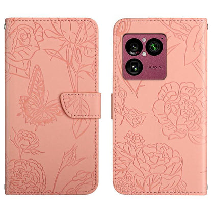 Pink butterfly-embossed leather flip phone case with camera cutout and magnetic strap
