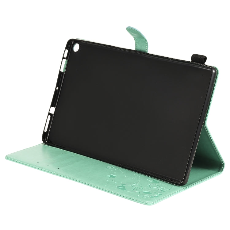 Green folio tablet case opened as a stand, showing black screen and corner cutouts