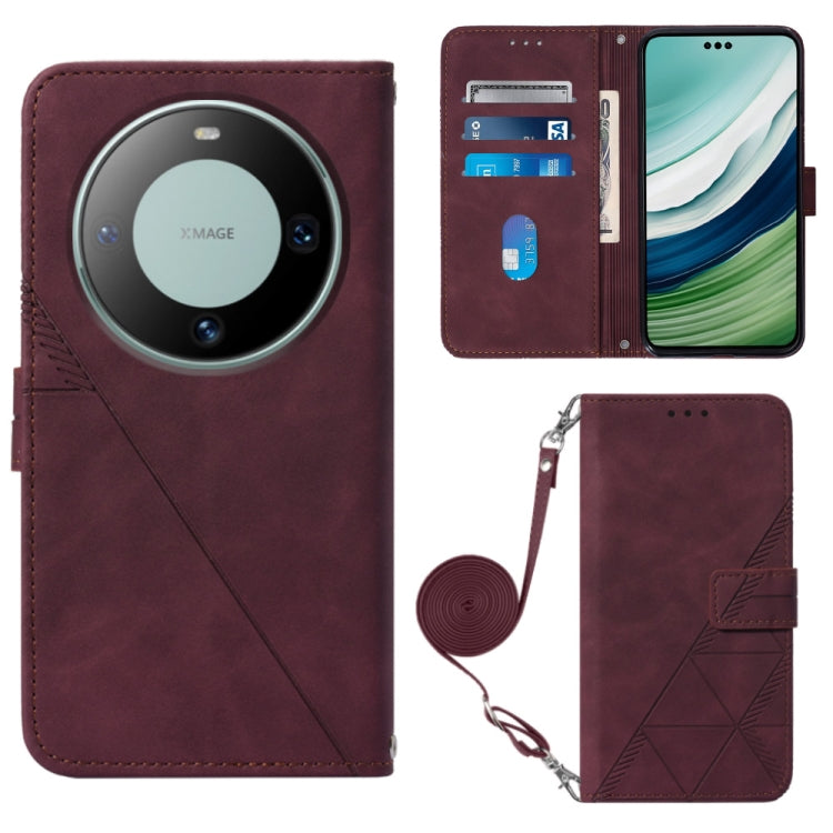 Wine red flip leather crossbody phone case with embossed pattern and wrist strap