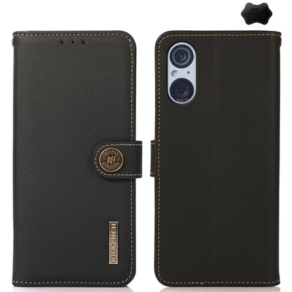 Black genuine leather phone case with flip cover, camera window, and stitched border