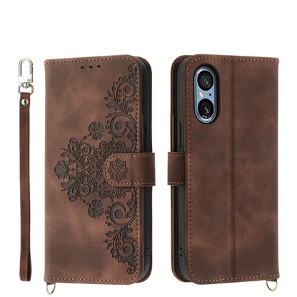 Brown embossed floral leather wallet phone case with flip cover