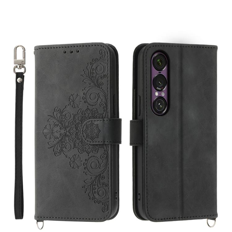 Black embossed floral wallet phone case with wrist strap and magnetic closure