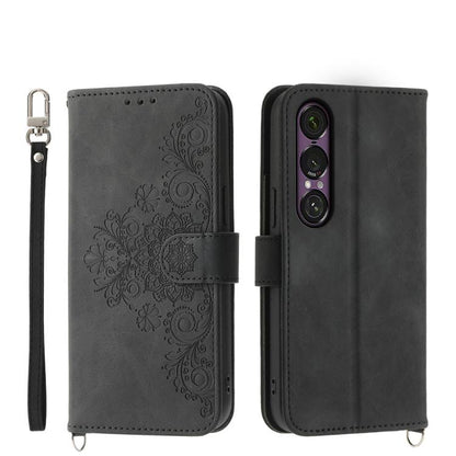 Black embossed floral wallet phone case with wrist strap and magnetic closure