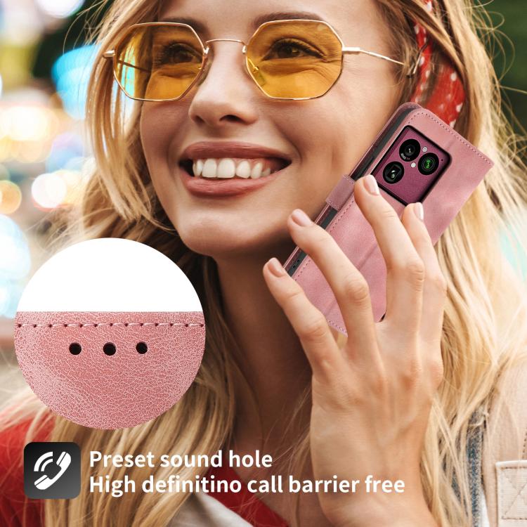 Pink leather phone wallet case with embossed floral pattern on phone