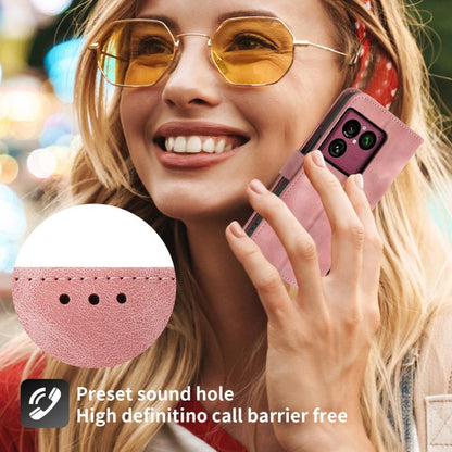 Pink leather phone wallet case with embossed floral pattern on phone